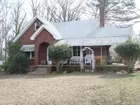 FIRE DAMAGED BRICK HOME SELLS ABSOLUTE