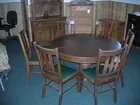 Round oak table with six chairs