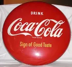 Round Coca-Cola sign
