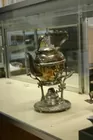 Silver Teapot and Warming cradle