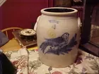 old crock with bird on branch
