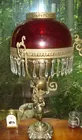 Brass cherub lamp w/ruby shade