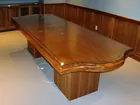 Walnut conference table with bronze inlays. 