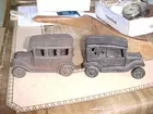 cast iron toy car on right