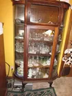 Antique curved glass china cabinet