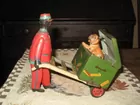 Rare porter man pushing dog wind up toy