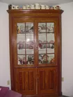grained corner cupboard