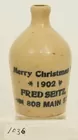 Mini tan jug, Merry Christmas 1902, Adv