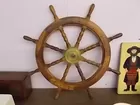 Reproduction ship wheel.