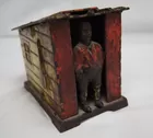 Cast Iron Cabin mechanical bank, black man, origin