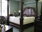 Ornately Carved Wooden King-Sized Bed 