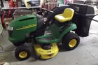 John Deere riding mower with grass catcher