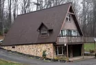 well-maintained A-Frame style house