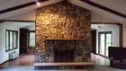 Central field stone fireplace