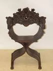 HEAVILY CARVED CHAIR