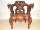 HEAVILY CARVED ORIENTAL CHAIR