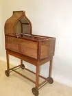 WALNUT CANED BASSINET