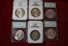 168) Graded Silver Dollars