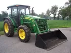With John Deere 553 Loader