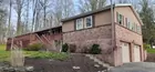 Raised Rancher with shop on 2.9 Acres