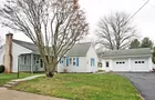 A 1-1/2 story sided three (3) bedroom house 