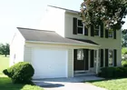 A 2-story sided 3- bedroom 1.5-bath house