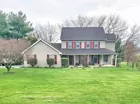 A two story four (4) bedroom sided house w/ garage