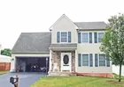 A 2-story 4-bedroom house w/ attached garage