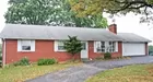 A brick 3-bedroom ranch style house w/ garage