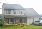 A 2-story 4-bedroom house w/ attached garage
