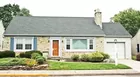 A 2-bedroom ranch style house w/ attached garage