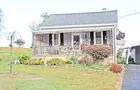 A 1-1/2 story 2-bedroom bungalow house