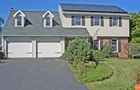 A 2-story 4-bedroom house w/ attached garage