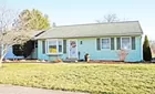 A 2-bedroom ranch style house w/ attached garage