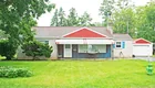 A brick 3-bedroom ranch house w/ detached garage