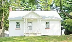 A stucco 2-bedroom ranch house on 0.861-acres