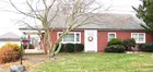 A brick 2-bedroom ranch style house