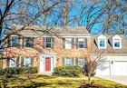 A 2-story brick 4-bedroom colonial style house