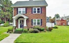 A 2-1/2 story house w/ a 3-bay garage 