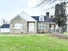 A cape cod style 3-bed house w/ detached garage
