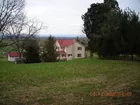 House and 12 acres / against mountain