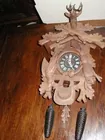 German cuckoo w/ carved game animals